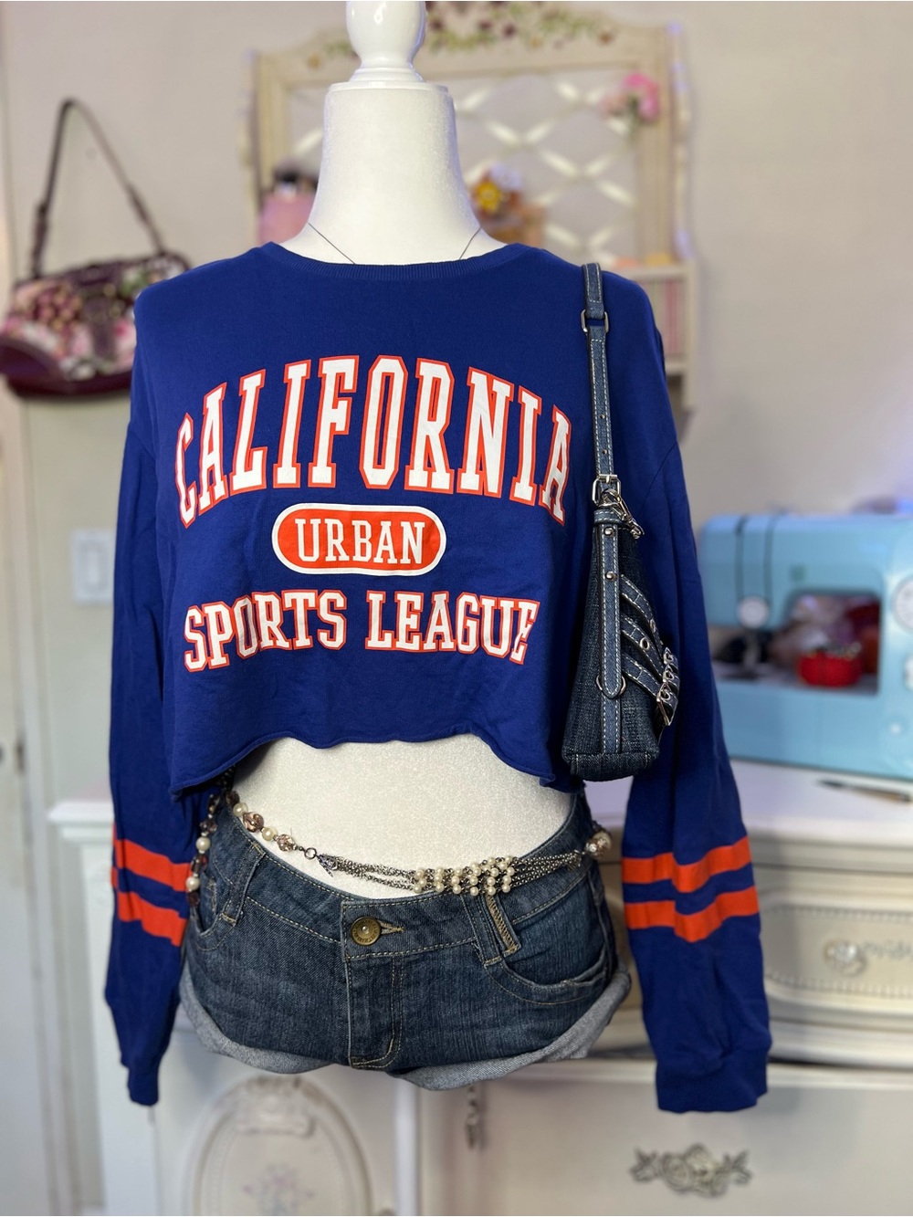 Discovery Blue Crop Sweatshirt with Orange Stripe Details